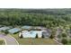 Wide aerial view of the community amenities, featuring a pool, tennis courts and clubhouse at 557 Winder Trl, Canton, GA 30114