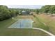 Aerial view of basketball court with benches and nearby baseball and tennis courts at 557 Winder Trl, Canton, GA 30114