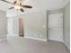 Large bedroom with neutral colors has large walk-in closet and an ensuite bathroom at 557 Winder Trl, Canton, GA 30114