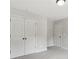 Bright bedroom with carpet features two closets, with one being a walk-in closet at 557 Winder Trl, Canton, GA 30114