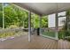 Covered deck featuring outdoor seating and views of the backyard at 557 Winder Trl, Canton, GA 30114
