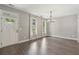 Light-filled dining room with hardwood floors and modern chandelier at 557 Winder Trl, Canton, GA 30114