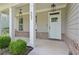 Close-up of a front door and porch with columns and landscaping at 557 Winder Trl, Canton, GA 30114