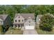 Charming two-story home with a well-manicured lawn and attached garage at 557 Winder Trl, Canton, GA 30114