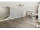 Spacious open-concept living room with hardwood floors flowing into the kitchen at 557 Winder Trl, Canton, GA 30114