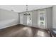 Bright living room with hardwood floors, neutral paint, and large windows providing natural light at 557 Winder Trl, Canton, GA 30114