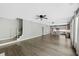 Open floor plan showcases hardwood floors, a staircase, and a glimpse into the modern kitchen with an island at 557 Winder Trl, Canton, GA 30114