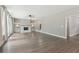 Bright living room boasts hardwood floors, a fireplace, and built-in shelving units at 557 Winder Trl, Canton, GA 30114
