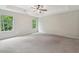 Bright and airy main bedroom with large windows and plush carpet at 557 Winder Trl, Canton, GA 30114