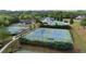 Aerial view of tennis courts, pool, and playground amenities in a well-maintained community at 557 Winder Trl, Canton, GA 30114