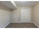 Bedroom with neutral colored walls and carpet with double door closet at 761 Caron Nw Cir, Atlanta, GA 30318