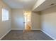Bedroom with neutral colored walls and carpet with an open door at 761 Caron Nw Cir, Atlanta, GA 30318