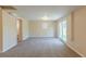 Spacious finished basement with neutral carpet and glass doors to the outside at 761 Caron Nw Cir, Atlanta, GA 30318