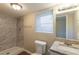 Bright bathroom with large shower and vanity with granite countertop at 761 Caron Nw Cir, Atlanta, GA 30318