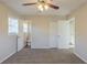 Neutral carpeted bedroom with two closets and an en suite bathroom at 761 Caron Nw Cir, Atlanta, GA 30318