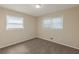 Bedroom with carpet flooring, two windows with blinds, and natural light at 761 Caron Nw Cir, Atlanta, GA 30318