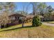 Charming one-story brick home with a well-maintained lawn and mature trees provides nice curb appeal at 761 Caron Nw Cir, Atlanta, GA 30318
