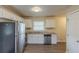 Kitchen with stainless steel appliances, granite countertops, and white cabinets at 761 Caron Nw Cir, Atlanta, GA 30318