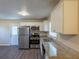 Kitchen with granite countertops, stainless steel appliances, and white cabinets at 761 Caron Nw Cir, Atlanta, GA 30318