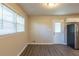 Bright kitchenette with wood-look flooring, natural light, and a door to the outside at 761 Caron Nw Cir, Atlanta, GA 30318