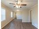 Living room featuring wood-look flooring, neutral paint, a ceiling fan, and natural light at 761 Caron Nw Cir, Atlanta, GA 30318