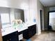 Bathroom featuring double sinks, large mirror, and vanity at 1980 Beyers Landing Dr, Buford, GA 30519