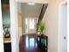 Inviting foyer with hardwood floors and staircase, illuminated by natural light at 1980 Beyers Landing Dr, Buford, GA 30519