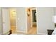 Hallway with wall decor, neutral carpet and paint at 1980 Beyers Landing Dr, Buford, GA 30519