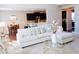 Open-concept living room with a neutral color palette and seamless flow to the kitchen at 1980 Beyers Landing Dr, Buford, GA 30519