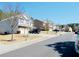 Street view of homes with well-maintained lawns, shade trees, and dark-colored SUVs at 1980 Beyers Landing Dr, Buford, GA 30519