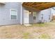 Covered patio area leading to a spacious backyard with lush green grass at 3478 Spring Place Ct, Loganville, GA 30052