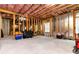 Unfinished basement with exposed wood framing and ample space for customization at 3478 Spring Place Ct, Loganville, GA 30052