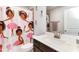 Bathroom featuring a playful shower curtain, a modern vanity, and decorative elements at 3478 Spring Place Ct, Loganville, GA 30052