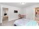 Bedroom featuring a desk and ensuite bathroom, creating a functional and private space at 3478 Spring Place Ct, Loganville, GA 30052