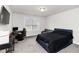 The bedroom has neutral walls and carpets along with a bed, desk, and sofa at 3478 Spring Place Ct, Loganville, GA 30052