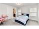 Bedroom with a bed and a pink desk, offering a cozy space for rest and study at 3478 Spring Place Ct, Loganville, GA 30052
