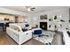 Bright living room features a modern fireplace, stylish rug and contemporary white sofa seating at 3478 Spring Place Ct, Loganville, GA 30052