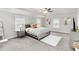 This main bedroom features windows, neutral walls, and tray ceilings at 3478 Spring Place Ct, Loganville, GA 30052