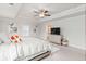 This main bedroom features tray ceilings, windows, and neutral walls at 3478 Spring Place Ct, Loganville, GA 30052