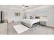 This main bedroom features two windows, neutral walls, and lots of space at 3478 Spring Place Ct, Loganville, GA 30052