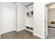 Mud room with storage cubbies and a view to the living room, providing organized space at 3478 Spring Place Ct, Loganville, GA 30052