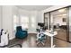 Bright office space with a white desk, ergonomic chair, and expansive window at 3478 Spring Place Ct, Loganville, GA 30052