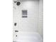Contemporary bathroom with subway tile, black fixtures, and a shower/tub combo at 3762 Larkspur Ter, Decatur, GA 30032
