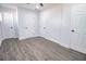This empty bedroom features hardwood-style floors and multiple doors at 3762 Larkspur Ter, Decatur, GA 30032