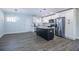Bright kitchen features stainless steel appliances, white cabinets, granite countertops and a stylish kitchen island at 3762 Larkspur Ter, Decatur, GA 30032