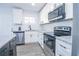 New kitchen design showcasing stainless appliances, subway tile, white cabinets, and granite countertops at 3762 Larkspur Ter, Decatur, GA 30032