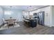Bright kitchen features modern island, recessed lights, stainless steel appliances, and open dining area at 3762 Larkspur Ter, Decatur, GA 30032