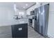 Contemporary kitchen boasts stainless steel appliances, granite counters, and a black kitchen island at 3762 Larkspur Ter, Decatur, GA 30032