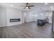 Living room featuring a modern fireplace, ceiling fan, recessed lighting, and wood-look floors at 3762 Larkspur Ter, Decatur, GA 30032