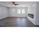 Bright living room with a modern fireplace, wood-look floors, recessed lighting, and lots of natural light at 3762 Larkspur Ter, Decatur, GA 30032